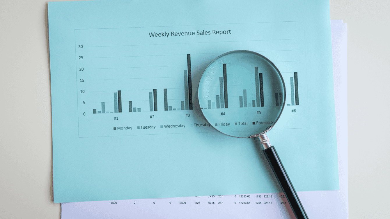 Graph on paper with magnifying glass